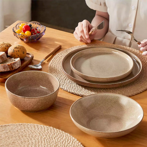 Handcrafted caramel stoneware with reactive glaze on woven placemats - perfect for farmhouse tables