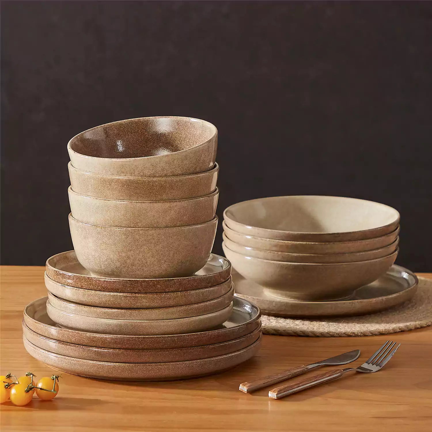 Handcrafted caramel stoneware with reactive glaze on woven placemats - perfect for farmhouse tables