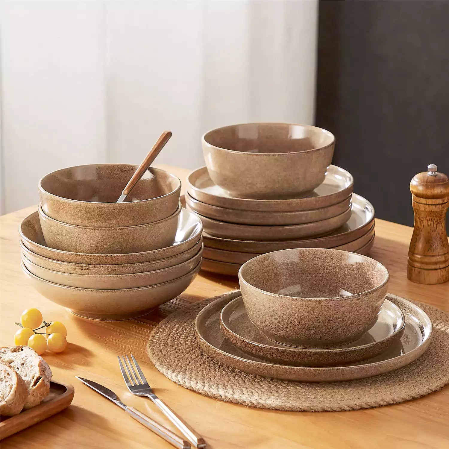 Handcrafted caramel stoneware with reactive glaze on woven placemats - perfect for farmhouse tables