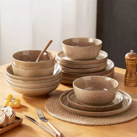 Handcrafted caramel stoneware with reactive glaze on woven placemats - perfect for farmhouse tables