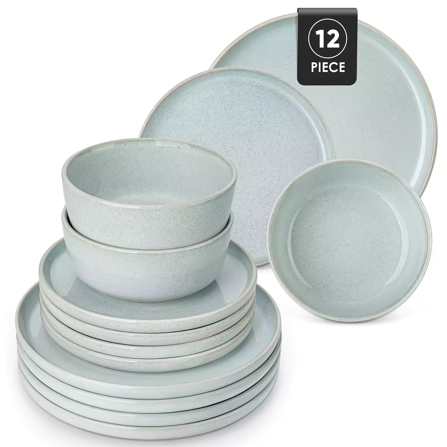 Mint green stoneware plates and bowls with reactive glaze on farmhouse wooden table with woven placemats