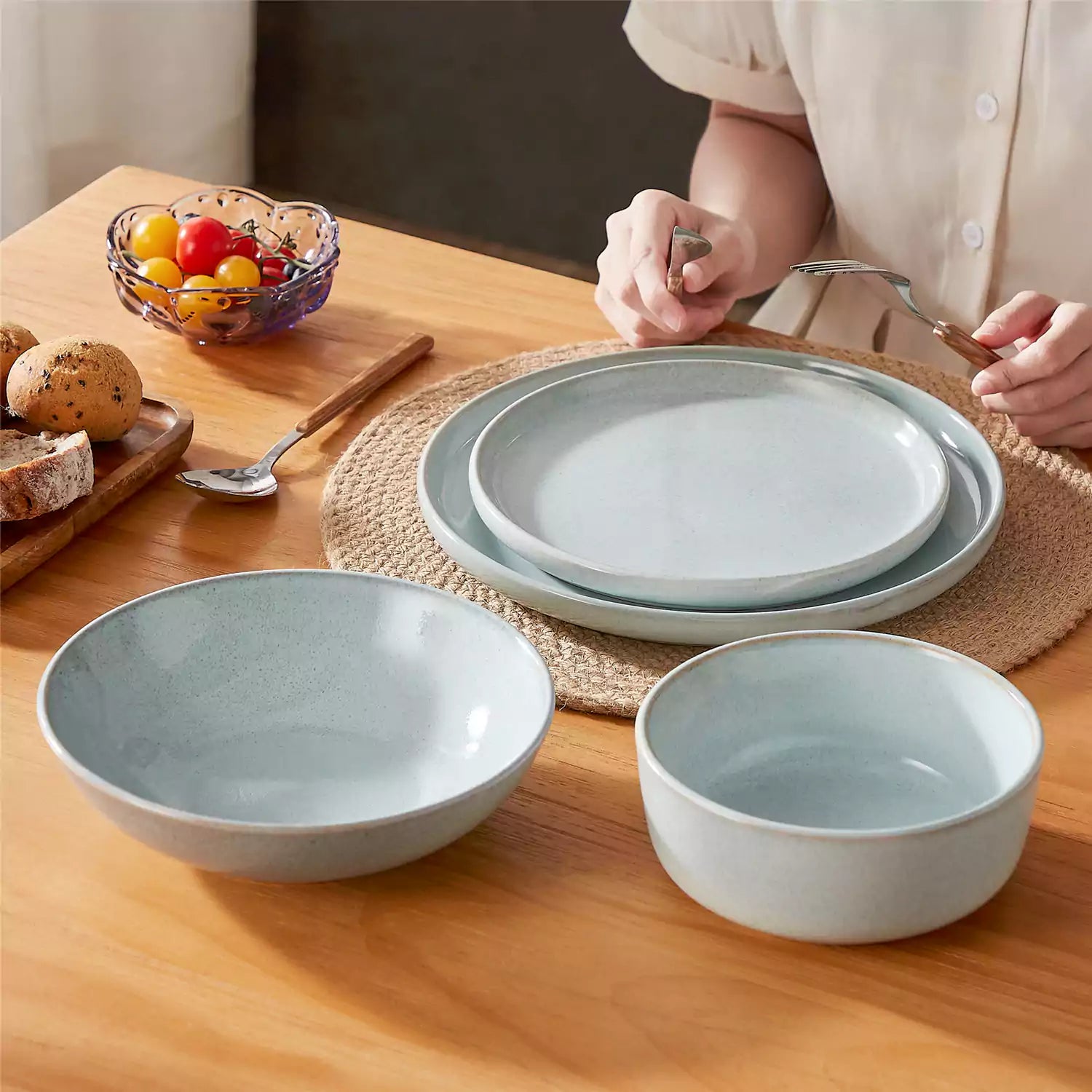 Handcrafted mint green stoneware with reactive glaze on woven placemats - perfect for farmhouse tables