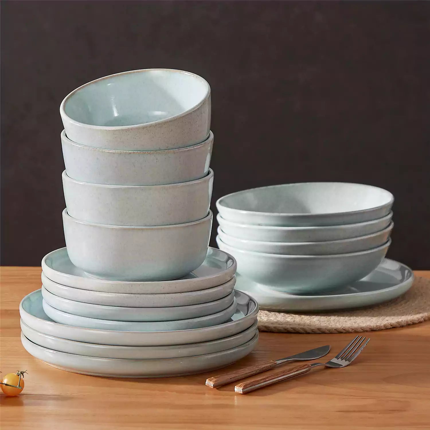 Handcrafted mint green stoneware with reactive glaze on woven placemats - perfect for farmhouse tables