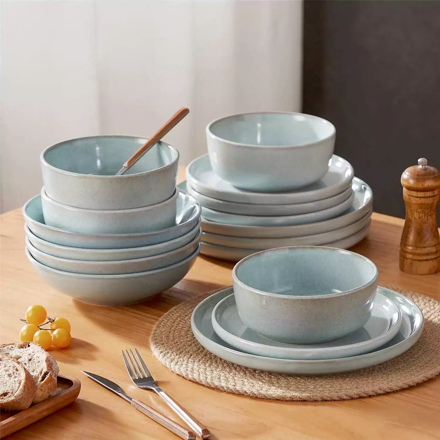 Handcrafted mint green stoneware with reactive glaze on woven placemats - perfect for farmhouse tables