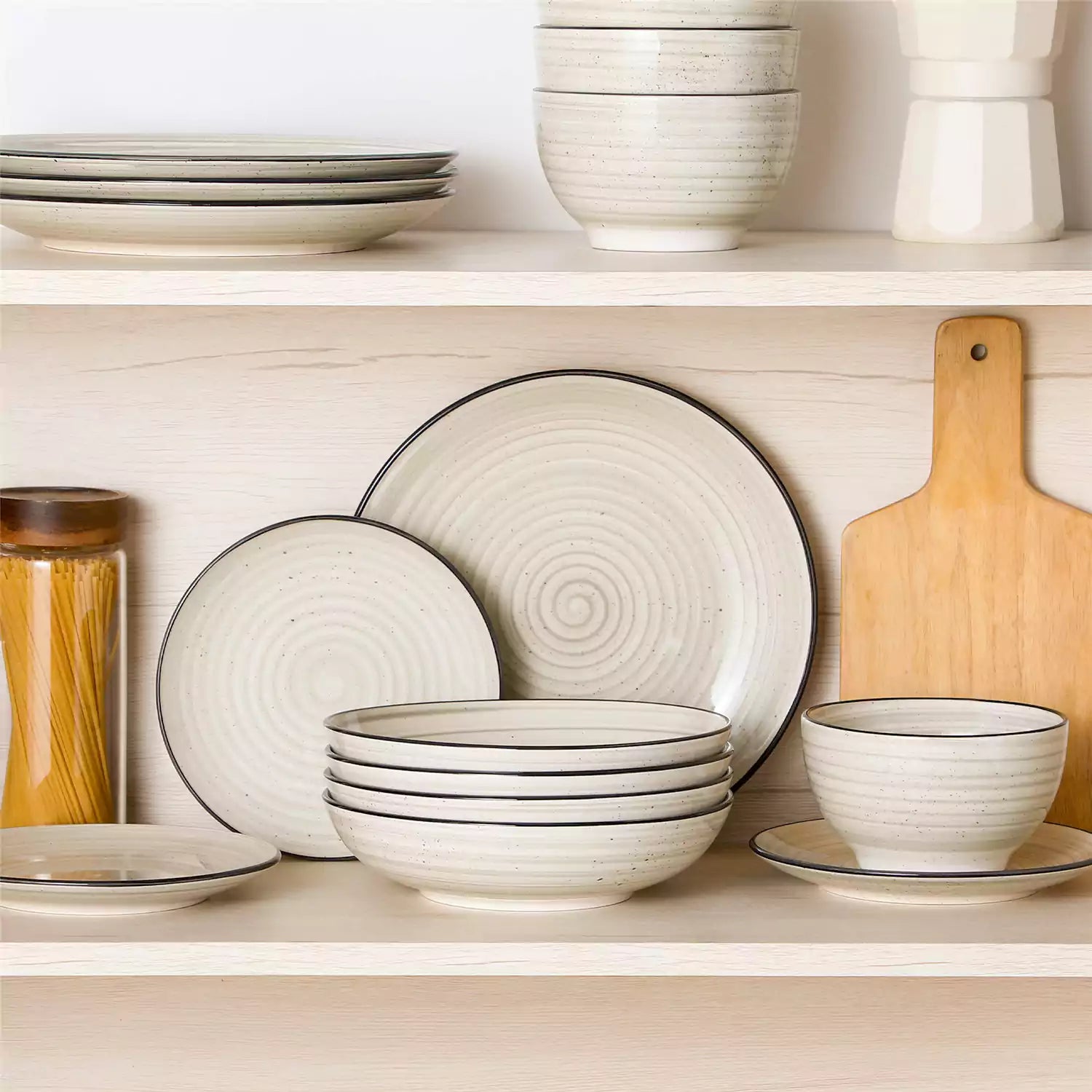 Bonbon stoneware pasta bowls in beige with spiral speckled glaze on a styled dining table