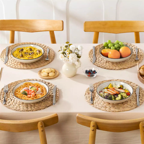 Bonbon stoneware pasta bowls in beige with spiral speckled glaze on a styled dining table