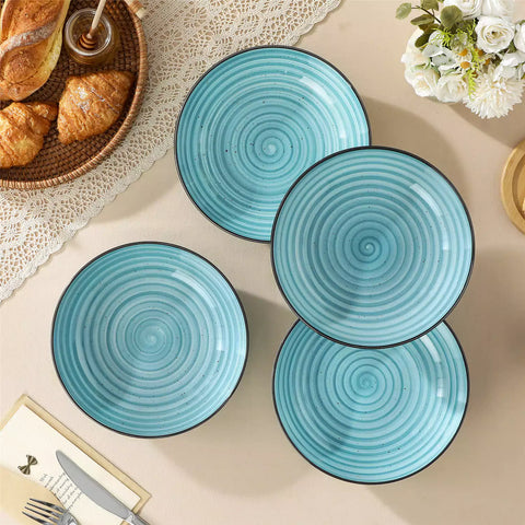 Bonbon stoneware pasta bowls in blue with spiral speckled glaze on a styled dining table