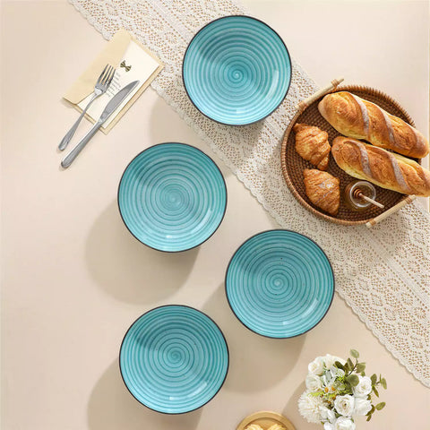 Bonbon stoneware pasta bowls in blue with spiral speckled glaze on a styled dining table