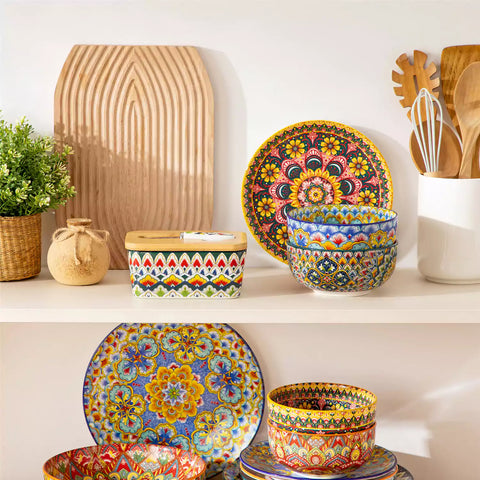 Lumi forest green porcelain butter dish with lid in vibrant Bohemian pattern on a wooden table