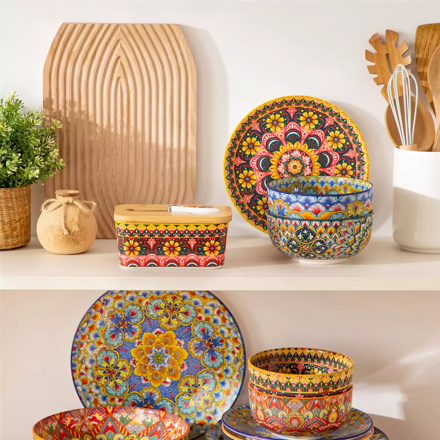 Lumi lemon yellow porcelain butter dish with lid in vibrant Bohemian pattern on a wooden table