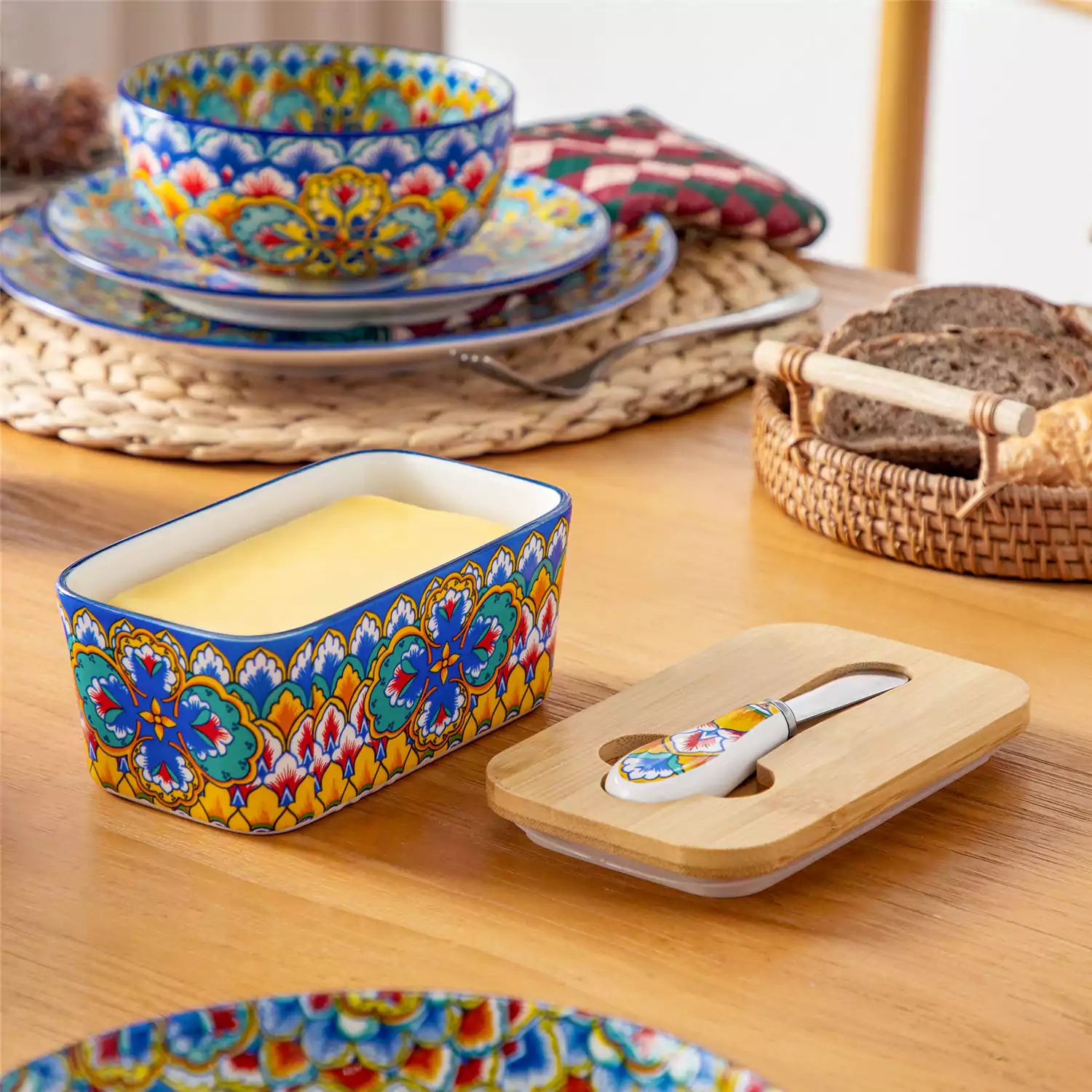 Lumi vibrant blue porcelain butter dish with lid in vibrant Bohemian pattern on a wooden table