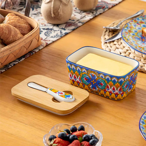 Lumi vibrant blue porcelain butter dish with lid in vibrant Bohemian pattern on a wooden table