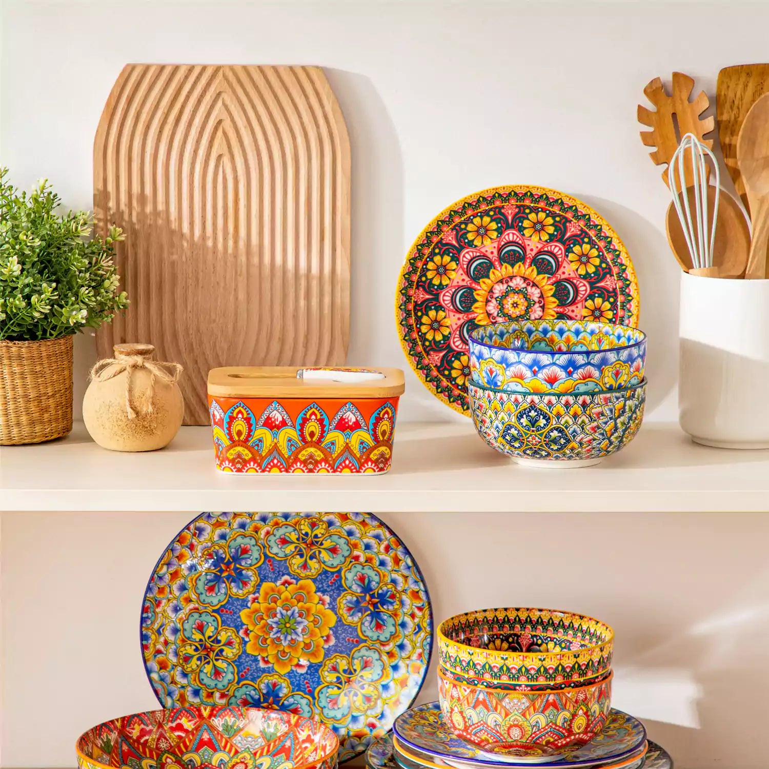 Lumi bold orange porcelain butter dish with lid in vibrant Bohemian pattern on a wooden table