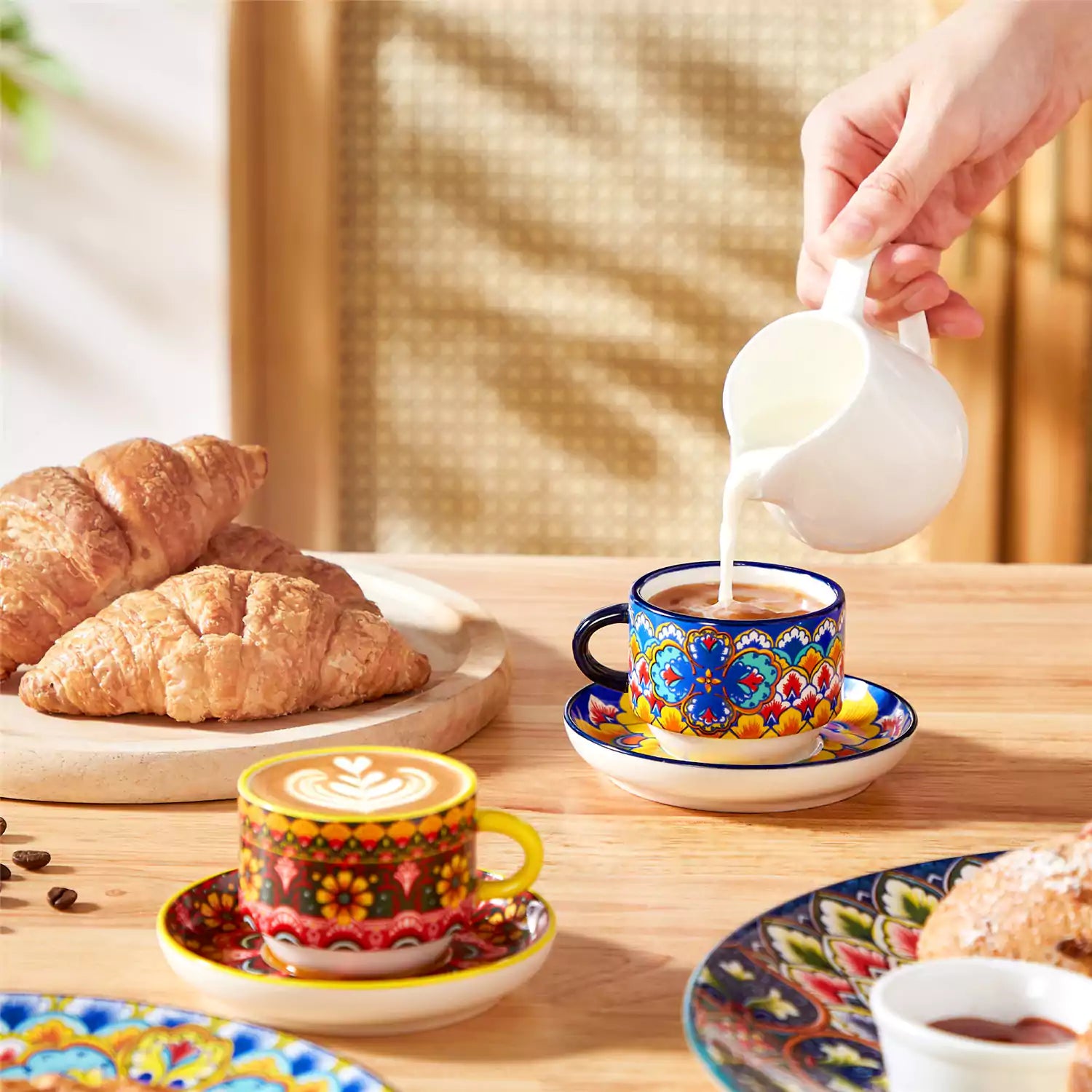 Lumi 6 piece 3oz porcelain coffee cup and saucer set with vibrant  pattern Bohemian design on a rustic wooden table