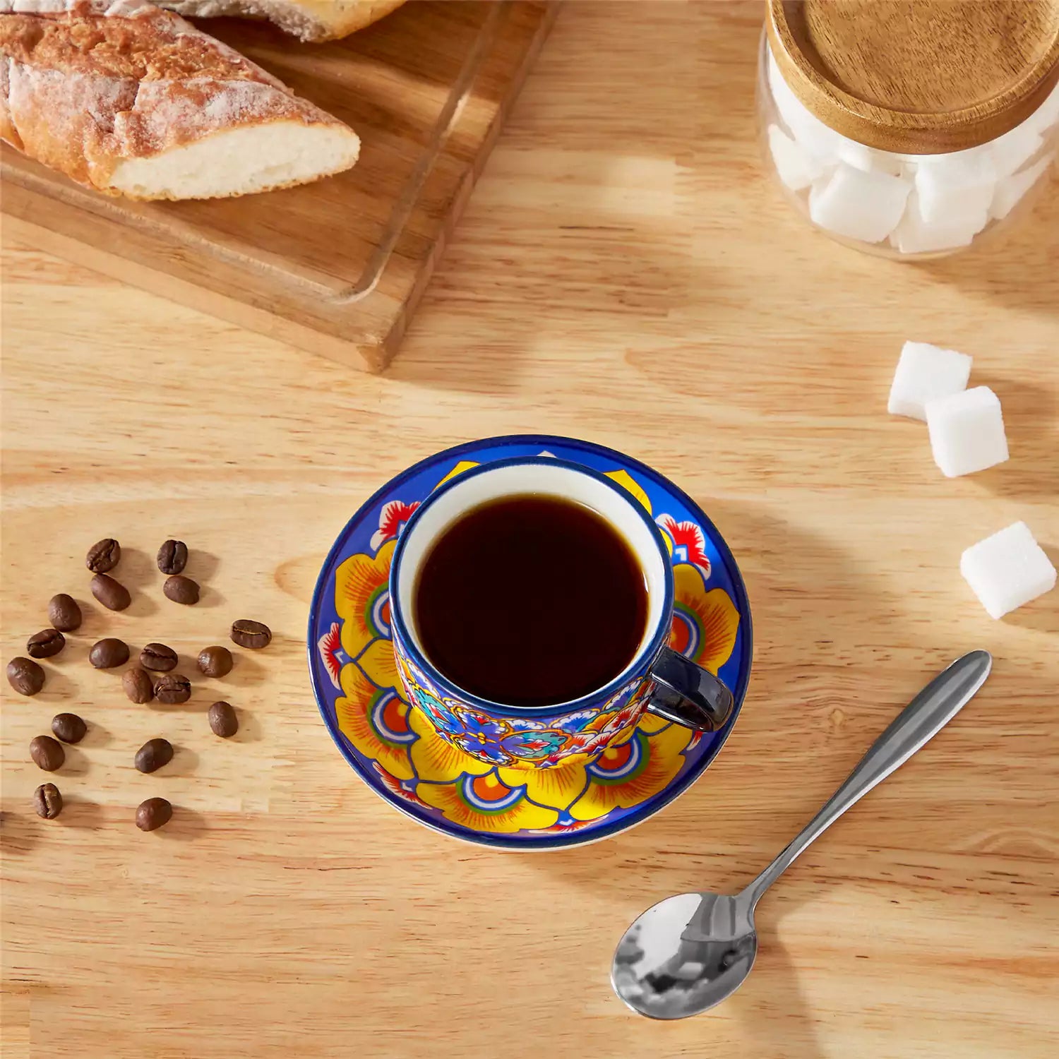 Lumi 6 piece 5oz porcelain coffee cup and saucer set with vibrant  pattern Bohemian design on a rustic wooden table