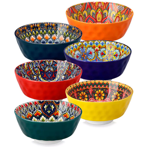 Colorful 26oz Lumi porcelain bowls on rattan placemats filled with oatmeal berries roasted broccoli and cherries on a linen table runner