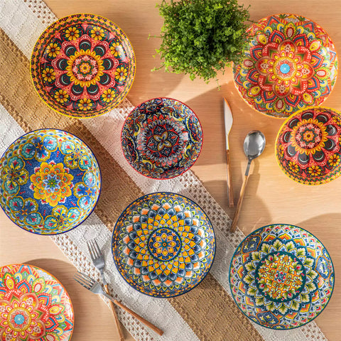 Vibrant Boho pasta bowls on a wooden table filled with pasta cherries and persimmons for a colorful, casual dining setting