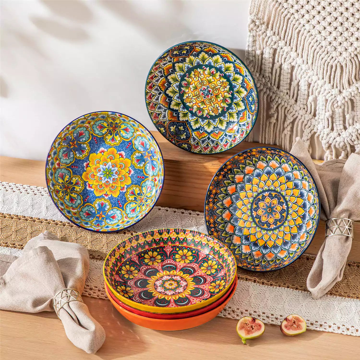 Vibrant Boho pasta bowls on a wooden table filled with pasta cherries and persimmons for a colorful, casual dining setting