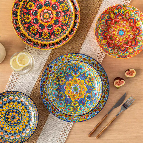 Vibrant Boho pasta bowls on a wooden table filled with pasta cherries and persimmons for a colorful, casual dining setting