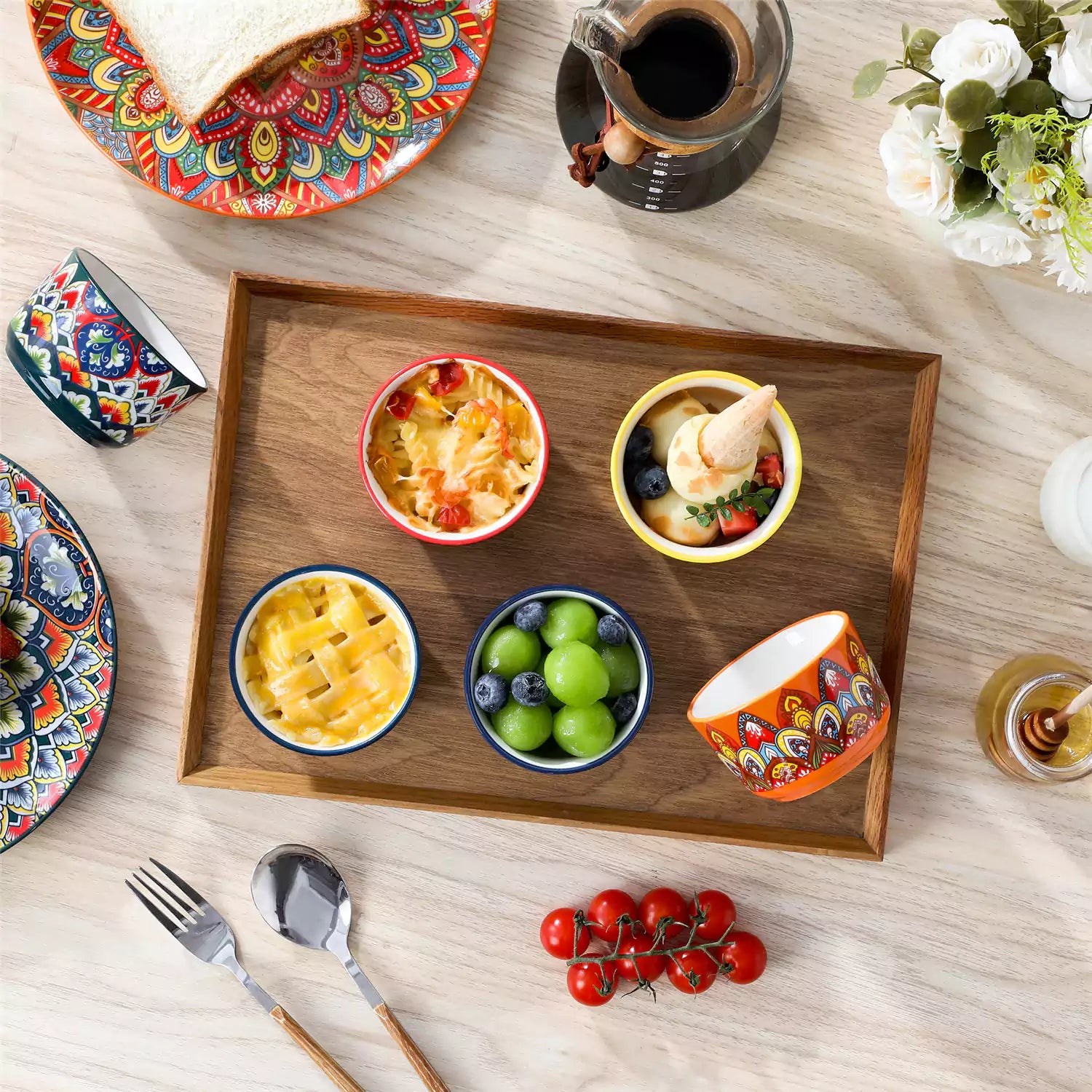 Lumi 6 piece 6oz porcelain ramekin bowls with vibrant Bohemian pattern on a rustic wooden tray