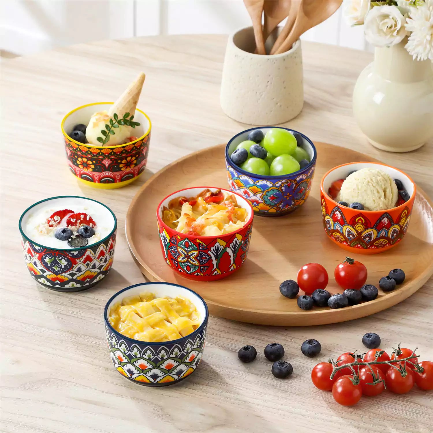 Lumi 6 piece 6oz porcelain ramekin bowls with vibrant Bohemian pattern on a rustic wooden tray