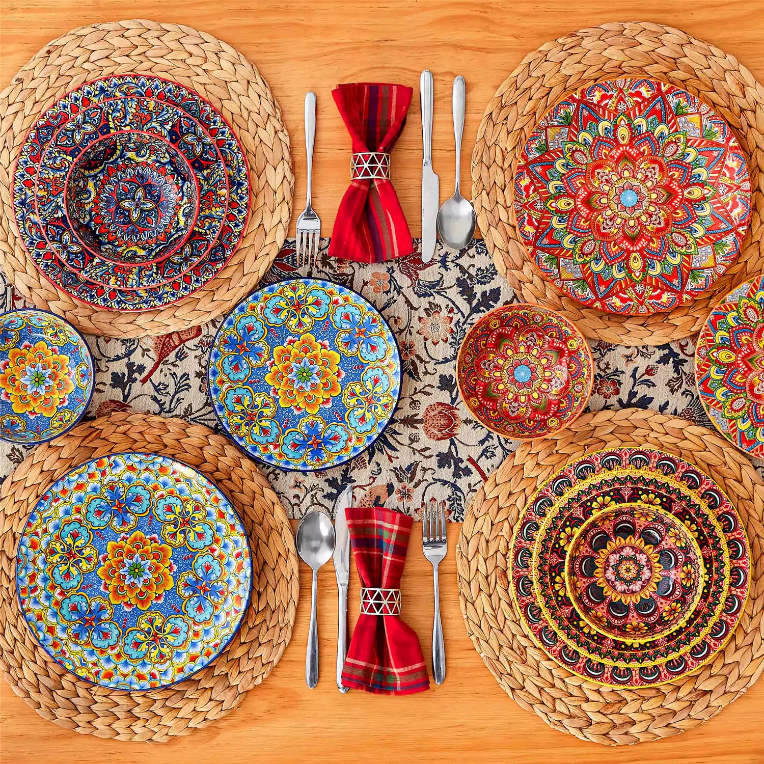 Lumi 12-piece Bohemian dinnerware set for 4 with colorful patterned plates and bowls on a wooden Boho dining table with food