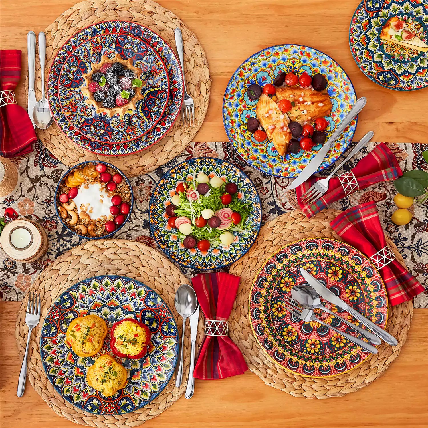 Lumi 18-piece Bohemian dinnerware set for six on a wooden table with colorful plates bowls and silverware in a playful Boho style
