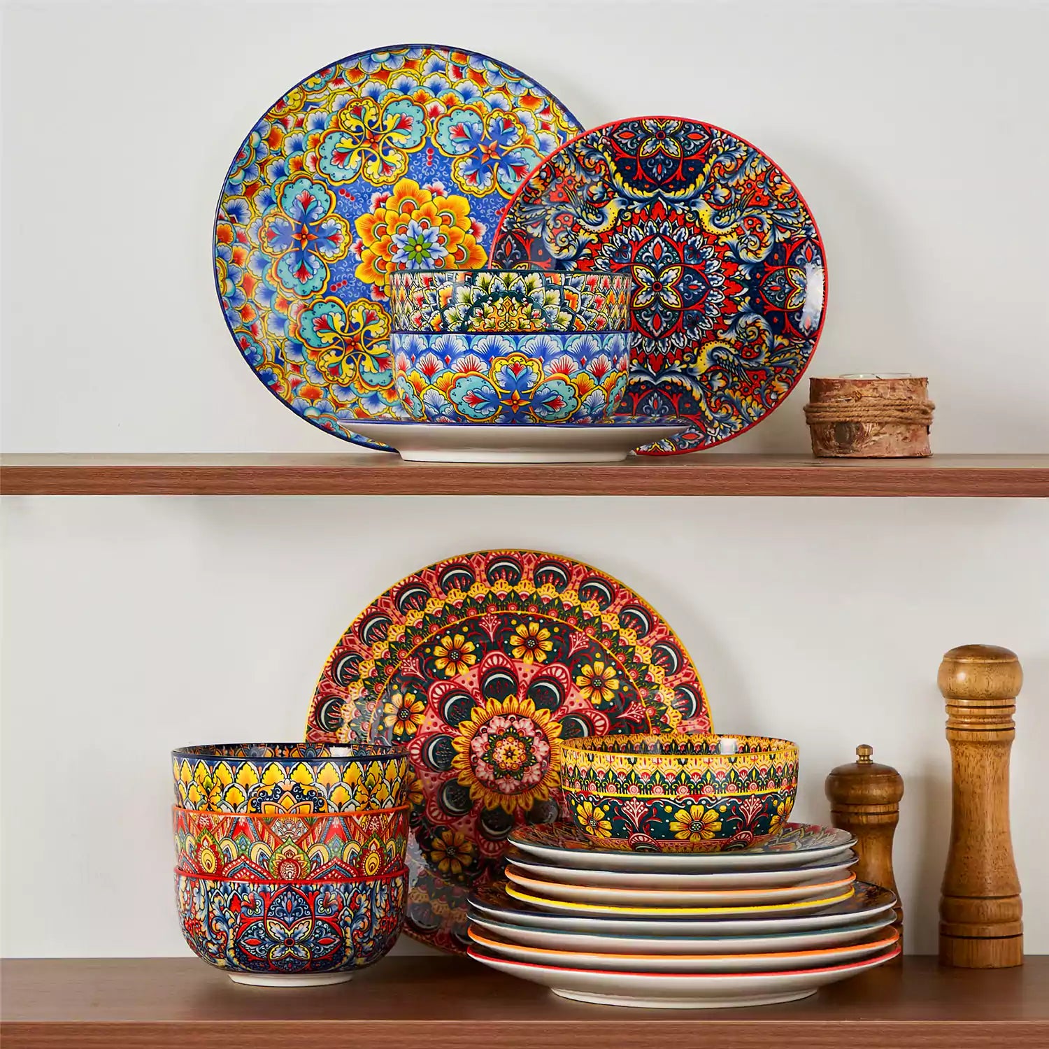 Lumi 18-piece Bohemian dinnerware set for six on a wooden table with colorful plates bowls and silverware in a playful Boho style