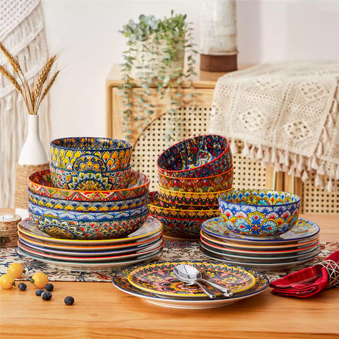 Bohemian style dining table set with Lumi 24 piece colorful dinnerware bowls and vibrant table décor ready for a lively meal