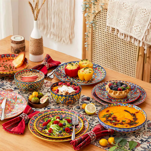 Bohemian style dining table set with Lumi 24 piece colorful dinnerware bowls and vibrant table décor ready for a lively meal