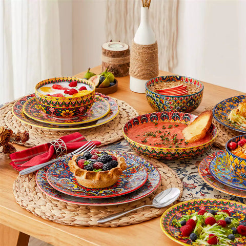 Bohemian style dining table set with Lumi 24 piece colorful dinnerware bowls and vibrant table décor ready for a lively meal