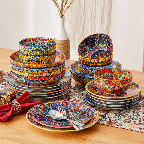 Bohemian style dining table set with Lumi 24 piece colorful dinnerware bowls and vibrant table décor ready for a lively meal