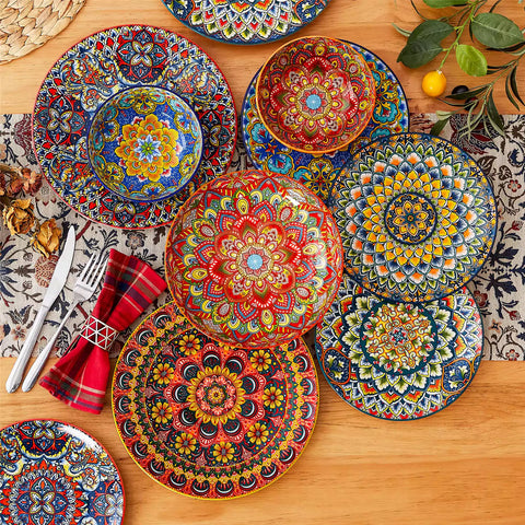 Bohemian style dining table set with Lumi 24 piece colorful dinnerware bowls and vibrant table décor ready for a lively meal
