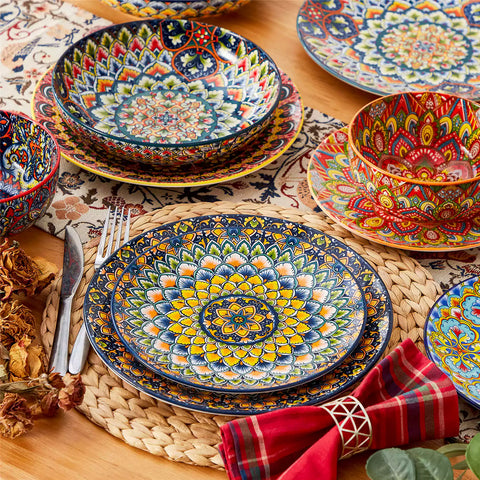 Bohemian style dining table set with Lumi 24 piece colorful dinnerware bowls and vibrant table décor ready for a lively meal