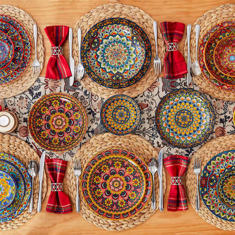 Bohemian style dining table set with Lumi 24 piece colorful dinnerware bowls and vibrant table décor ready for a lively meal