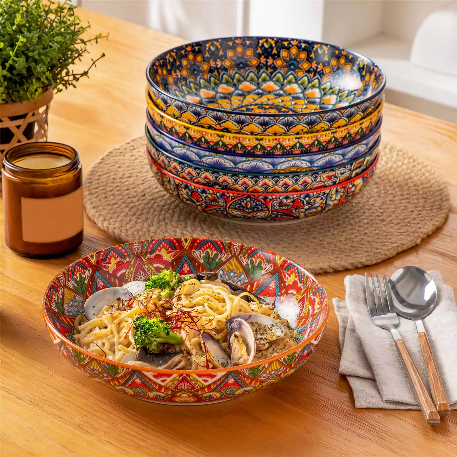 Vibrant Lumi porcelain pasta bowls filled with fruit salad pumpkin soup and pasta on a wooden dining table
