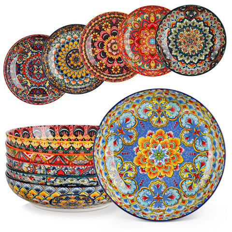 Vibrant Lumi porcelain pasta bowls filled with fruit salad pumpkin soup and pasta on a wooden dining table