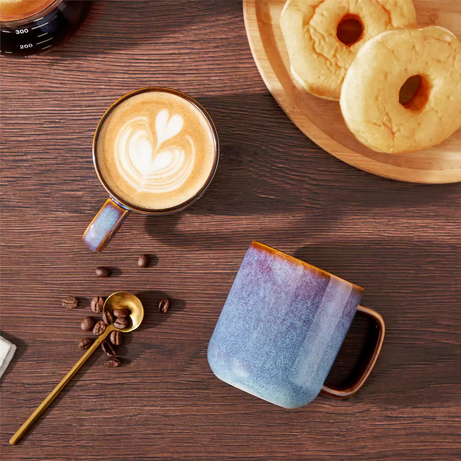 Cup of coffee with latte art cookies and coffee beans on a wooden table featuring onion mugs set of 4 in 12oz