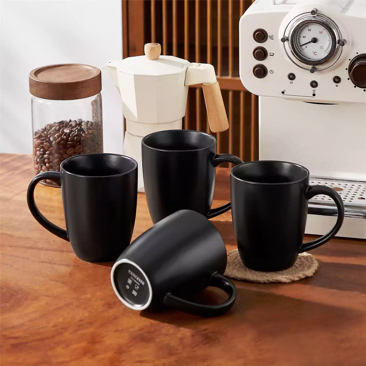 Playa 16oz stoneware mug in black on a rustic wooden kitchen table for a modern breakfast with coffee and fresh fruit