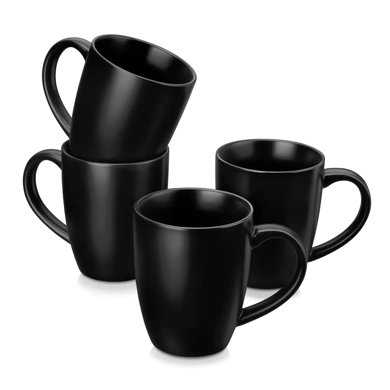 Playa set of four black stoneware mugs and a classic Moka pot on a wooden tray with a morning brew beside fresh pastries and coffee beans