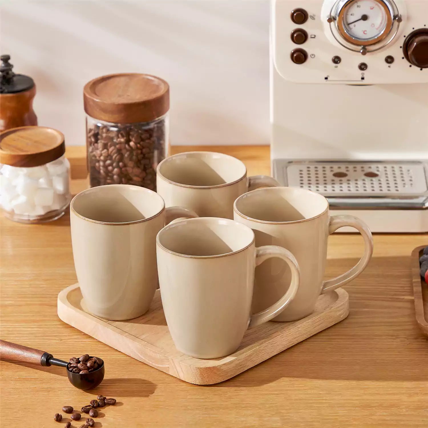 Playa 16oz stoneware mugs in brown reactive glaze on a rustic wooden surface for a cozy morning pour with coffee carafe and scattered beans