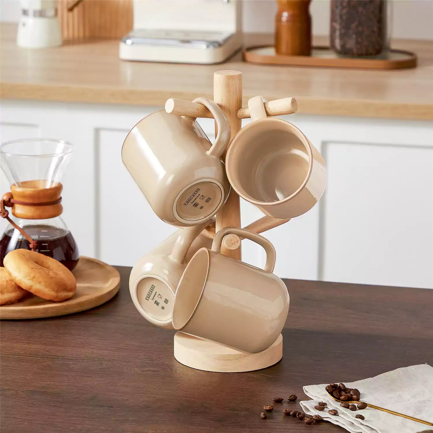 Playa 16oz stoneware mugs in brown reactive glaze on a rustic wooden café table with coffee maker and pastries