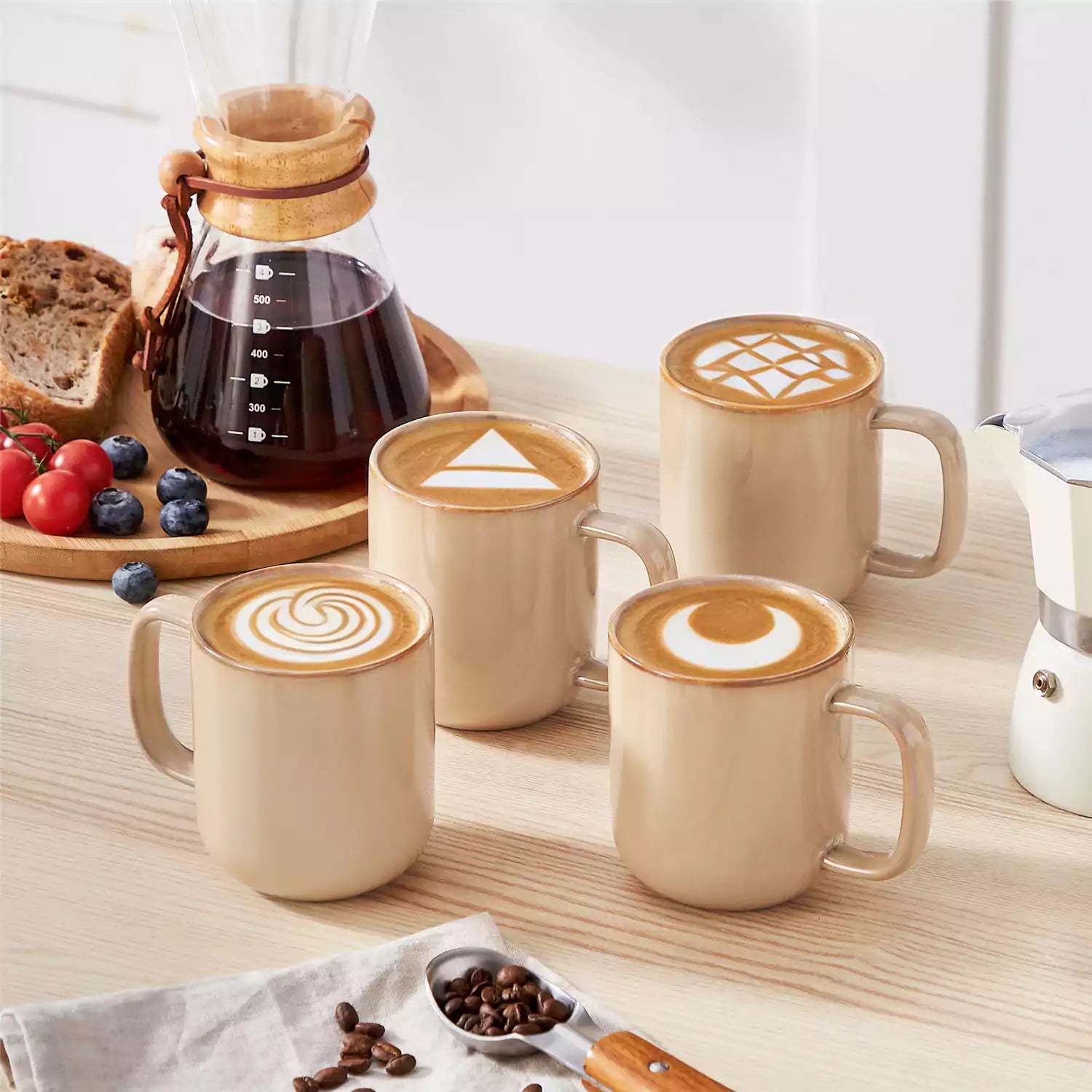 Playa 12oz stoneware mugs in glossy brown reactive glaze on a rustic wooden table for a cozy breakfast with fresh coffee pastries and berries