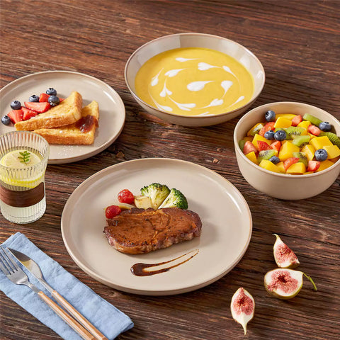 A glossy caramel 16-piece stoneware dinnerware set from the Playa collection - featuring farmhouse charm with plates and bowls for 4 people-vancasso