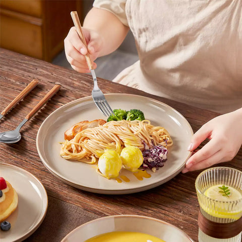 A glossy caramel 16-piece stoneware dinnerware set from the Playa collection - featuring farmhouse charm with plates and bowls for 4 people-vancasso