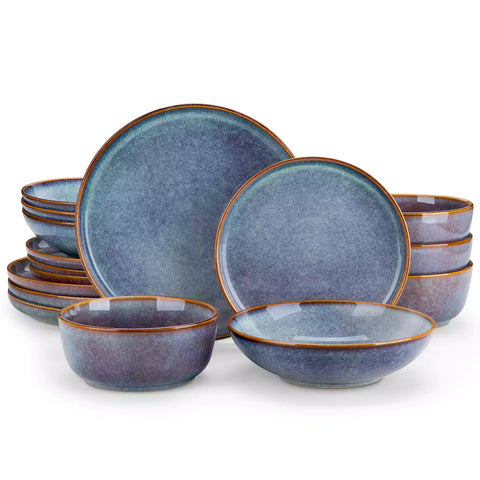 A glossy deep indigo 16-piece stoneware dinnerware set from the Playa collection - featuring farmhouse charm with plates and bowls for 4 people-vancasso