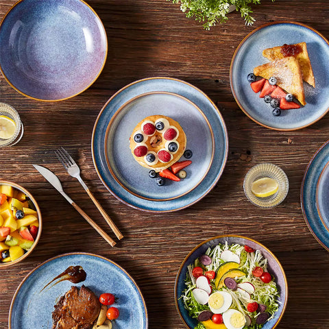 A glossy deep indigo 16-piece stoneware dinnerware set from the Playa collection - featuring farmhouse charm with plates and bowls for 4 people-vancasso