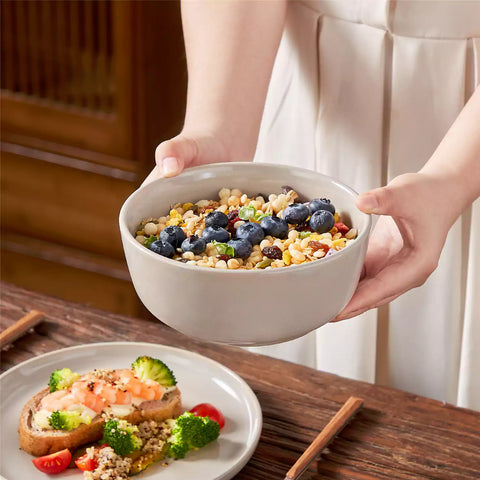 A glossy grey 16-piece stoneware dinnerware set from the Playa collection - featuring farmhouse charm with plates and bowls for 4 people-vancasso