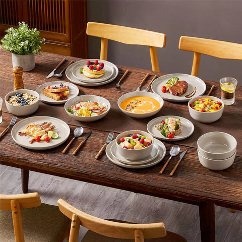 A glossy grey 16-piece stoneware dinnerware set from the Playa collection - featuring farmhouse charm with plates and bowls for 4 people-vancasso