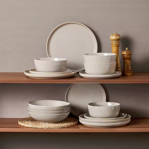 A glossy grey 16-piece stoneware dinnerware set from the Playa collection - featuring farmhouse charm with plates and bowls for 4 people-vancasso